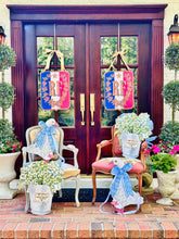 Load image into Gallery viewer, Lilly of the Valley in French Champagne Bucket Door Hanger with goose, french crest on double french wooden doors
