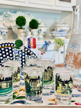 Load image into Gallery viewer, Acrylic drink stir swizzle sticks lilly of valley in champagen bucket, french goose topiary, vintage clock, vintage armchair french shield
