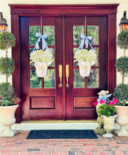 Load image into Gallery viewer, Lilly of the Valley in French Champagne Bucket Door Hanger on double french wooden doors
